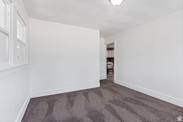 333 S 100 W, Payson, UT 84651 - unfurnished room with dark carpet, a textured ceiling, and baseboards