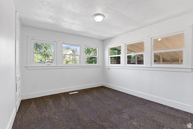 333 S 100 W, Payson, UT 84651 - empty room featuring dark carpet, a textured ceiling, and baseboards
