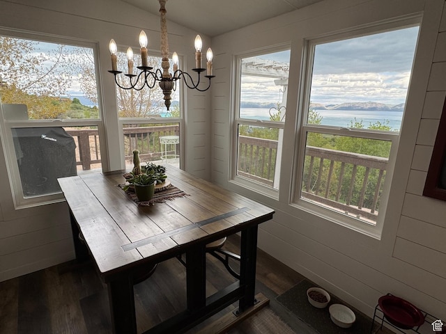 46 Alder Ct Unit 638, Fish Haven, ID 83287 - dining space with dark wood-style floors, a chandelier, healthy amount of natural light, lofted ceiling, and a water view