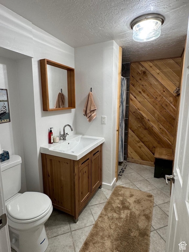 46 Alder Ct Unit 638, Fish Haven, ID 83287 - bathroom with toilet, tile patterned floors, vanity, curtained shower, and a textured ceiling