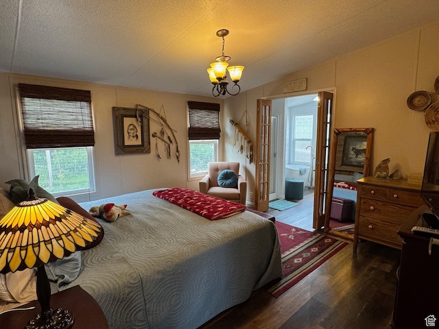 46 Alder Ct Unit 638, Fish Haven, ID 83287 - bedroom featuring wood finished floors, lofted ceiling, a textured ceiling, and a chandelier