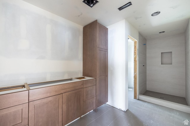 3685 S Craig Cir E, Millcreek, UT 84109 - full bathroom featuring tile patterned flooring and a tile shower
