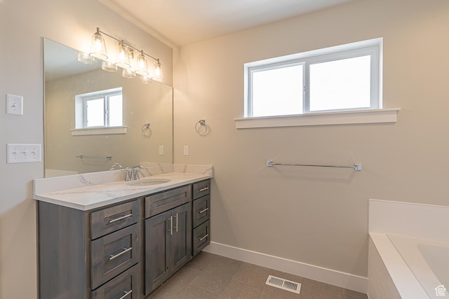 2205 S 1120 W Unit 62, Nibley, UT 84321 - full bath with baseboards, vanity, a tub, and tile patterned floors