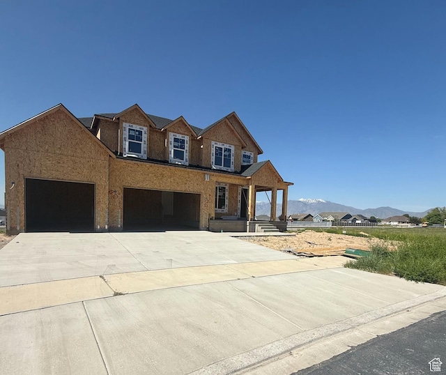1046 S 650 W Unit 1, Salem, UT 84653 - view of front facade featuring driveway, a mountain view, a porch, and a garage