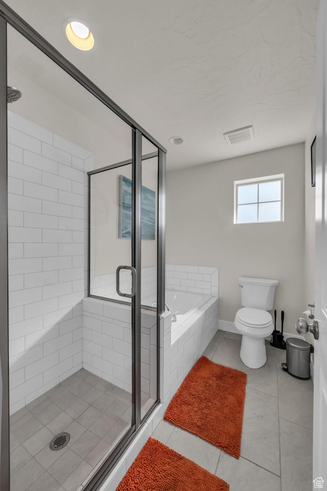 1189 N Bello Aly, Washington, UT 84780 - bathroom featuring a shower stall, tile patterned floors, a bath, toilet, and baseboards