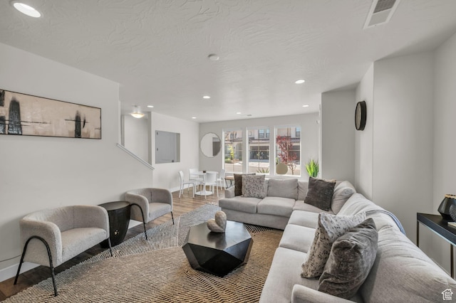 1189 N Bello Aly, Washington, UT 84780 - living area featuring wood finished floors, recessed lighting, a textured ceiling, and baseboards