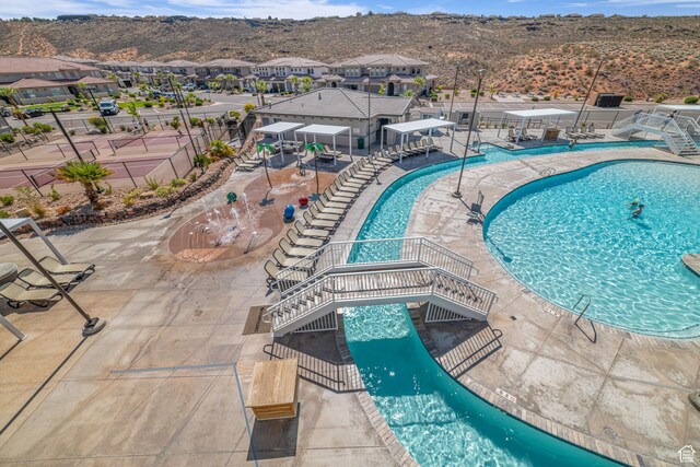 1189 N Bello Aly, Washington, UT 84780 - community pool with a mountain view, a patio, and a residential view