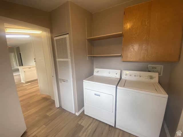 43 E 300 N, Duchesne, UT 84021 - laundry room with washing machine and clothes dryer, light wood-style flooring, cabinet space, and baseboards