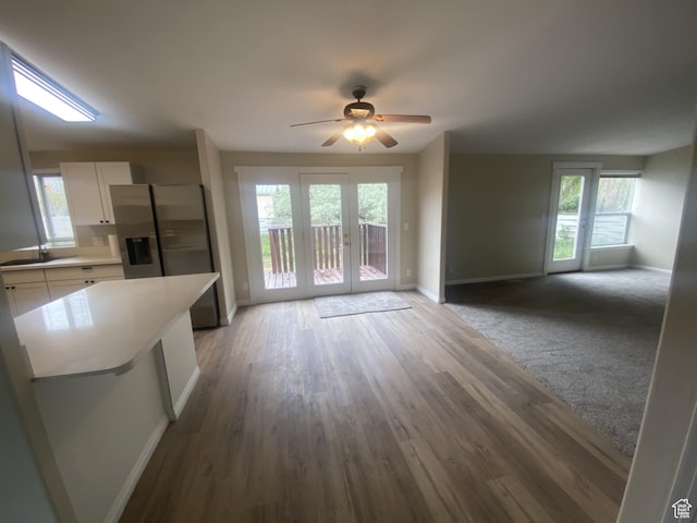 43 E 300 N, Duchesne, UT 84021 - unfurnished living room with baseboards, ceiling fan, wood finished floors, and a sink