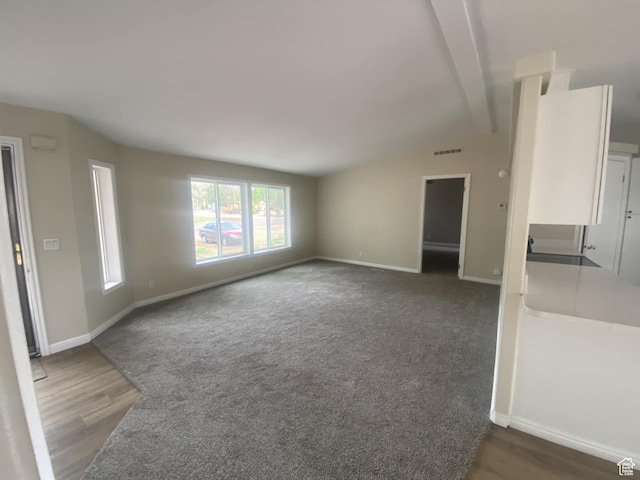 43 E 300 N, Duchesne, UT 84021 - unfurnished living room with baseboards and dark wood finished floors