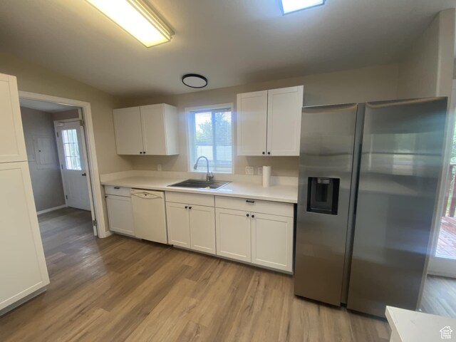 43 E 300 N, Duchesne, UT 84021 - kitchen featuring stainless steel fridge, a sink, dishwasher, light countertops, and white cabinets
