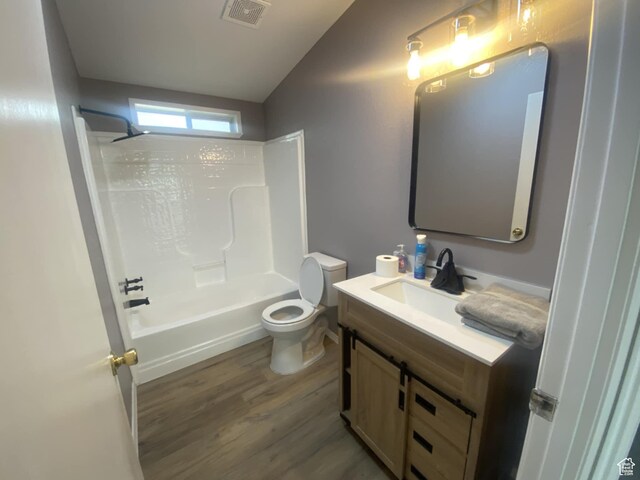 43 E 300 N, Duchesne, UT 84021 - bathroom with wood finished floors, toilet, vanity, lofted ceiling, and  shower combination
