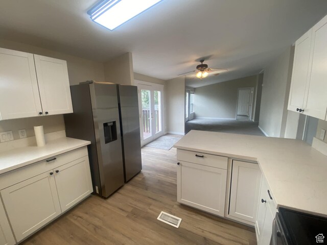 43 E 300 N, Duchesne, UT 84021 - kitchen with appliances with stainless steel finishes, a peninsula, white cabinets, light countertops, and vaulted ceiling