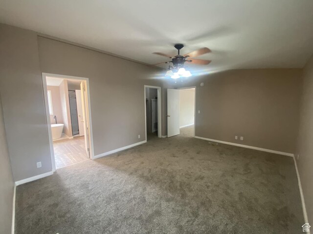 43 E 300 N, Duchesne, UT 84021 - unfurnished bedroom with carpet, a walk in closet, baseboards, connected bathroom, and a ceiling fan