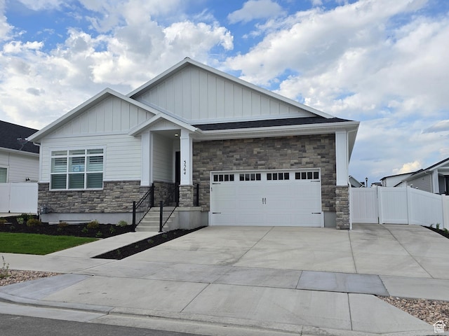 3564 W Haven Hollow Dr S, South Jordan, UT 84095 - craftsman-style home with board and batten siding, stone siding, driveway, and a garage