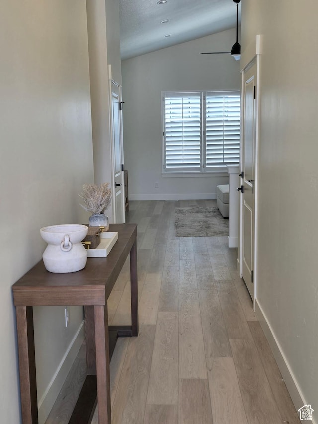 3564 W Haven Hollow Dr S, South Jordan, UT 84095 - corridor featuring light wood finished floors, baseboards, and vaulted ceiling
