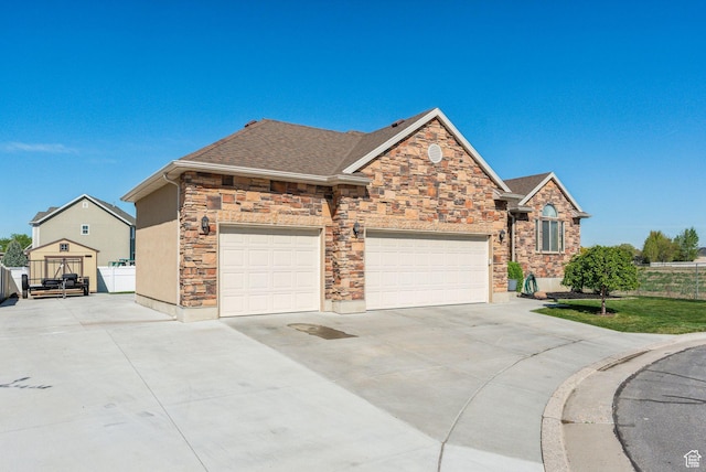 1044 S 1775 W, Syracuse, UT 84075 - view of front of property with concrete driveway, stone siding, an attached garage, and a shingled roof