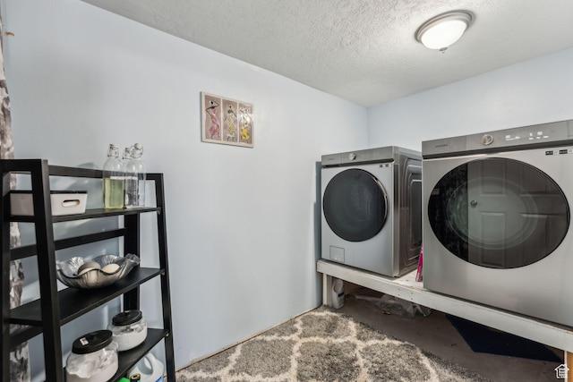 1044 S 1775 W, Syracuse, UT 84075 - washroom featuring washer and clothes dryer and a textured ceiling
