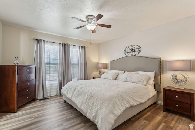 1044 S 1775 W, Syracuse, UT 84075 - bedroom with wood finished floors, a textured ceiling, and a ceiling fan
