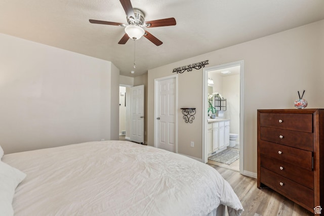 1044 S 1775 W, Syracuse, UT 84075 - bedroom featuring light wood-type flooring, ensuite bath, baseboards, and a ceiling fan