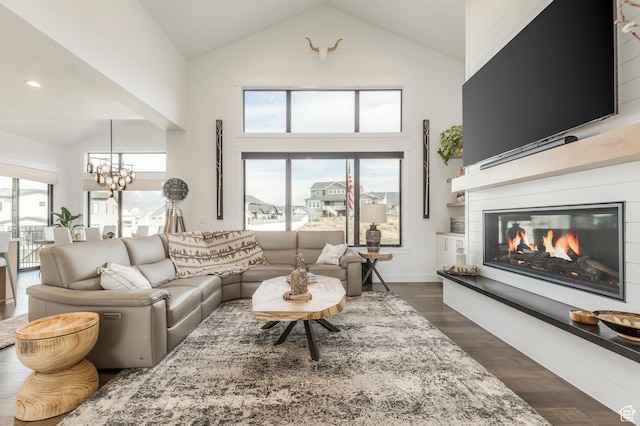 717 N Bridal Creek Ln E, Heber City, UT 84032 - living area featuring high vaulted ceiling, a glass covered fireplace, healthy amount of natural light, a chandelier, and dark wood finished floors