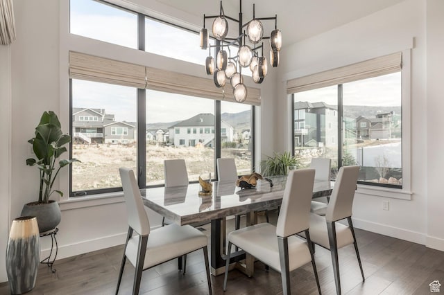 717 N Bridal Creek Ln E, Heber City, UT 84032 - dining area featuring a chandelier, plenty of natural light, baseboards, and dark wood finished floors