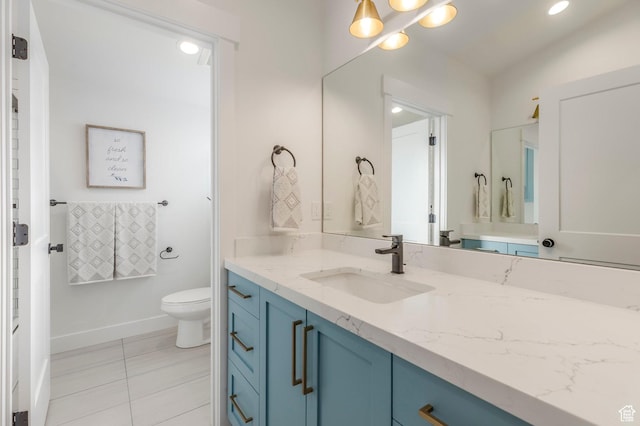 717 N Bridal Creek Ln E, Heber City, UT 84032 - bathroom with toilet, vanity, baseboards, and tile patterned floors