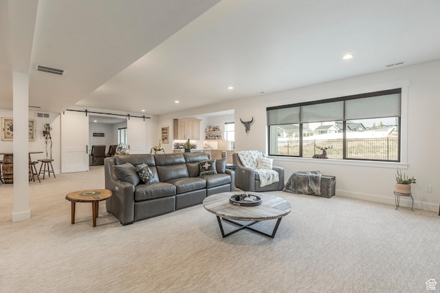 717 N Bridal Creek Ln E, Heber City, UT 84032 - living room with light carpet, a barn door, recessed lighting, and baseboards