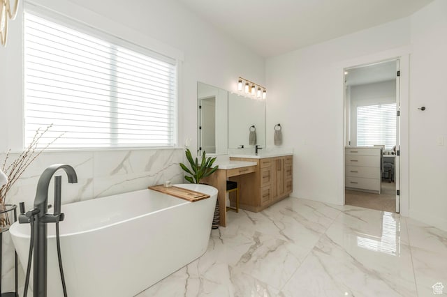 717 N Bridal Creek Ln E, Heber City, UT 84032 - bathroom featuring vanity, a freestanding bath, and marble finish flooring