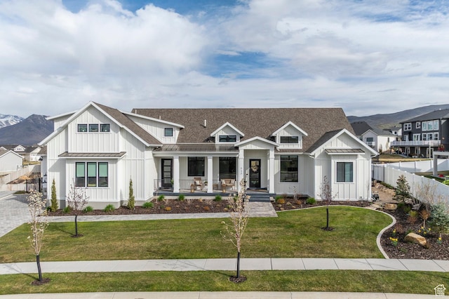 717 N Bridal Creek Ln E, Heber City, UT 84032 - modern farmhouse with board and batten siding, covered porch, a standing seam roof, metal roof, and a mountain view