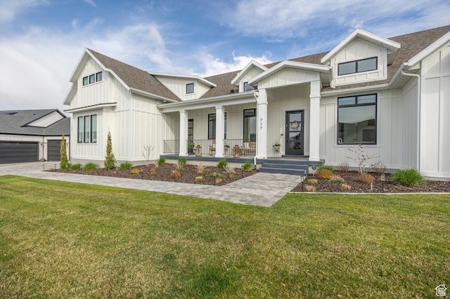 717 N Bridal Creek Ln E, Heber City, UT 84032 - modern farmhouse featuring covered porch, board and batten siding, a shingled roof, and a front lawn
