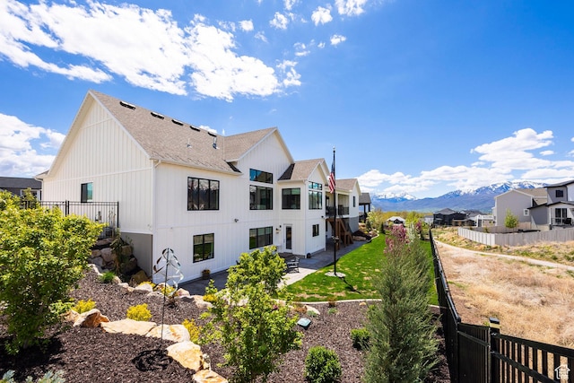 717 N Bridal Creek Ln E, Heber City, UT 84032 - back of property with roof with shingles, a mountain view, a patio, and a fenced backyard