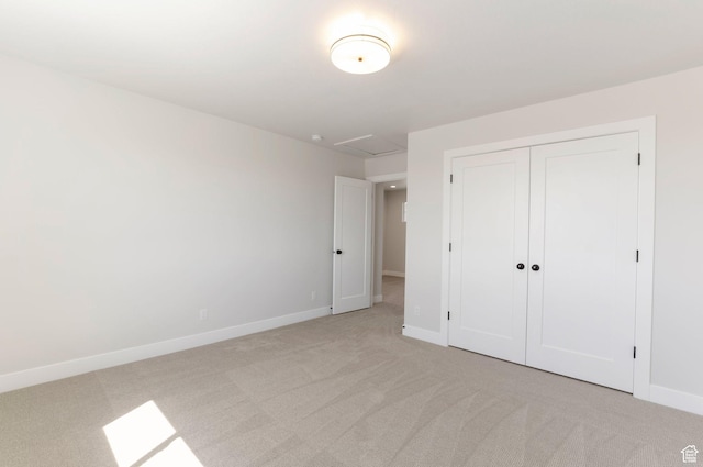 2133 N 725 W, Centerville, UT 84014 - unfurnished bedroom featuring light carpet, attic access, baseboards, and a closet