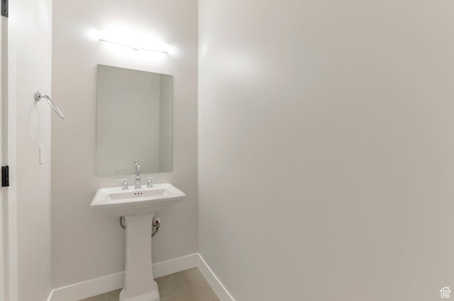 2133 N 725 W, Centerville, UT 84014 - bathroom featuring tile patterned floors, baseboards, and a sink