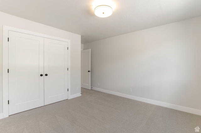 2133 N 725 W, Centerville, UT 84014 - unfurnished bedroom featuring light carpet, baseboards, and a closet