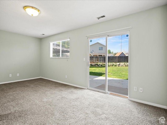 2014 S Jenny Ln, Clearfield, UT 84015 - carpeted empty room with baseboards