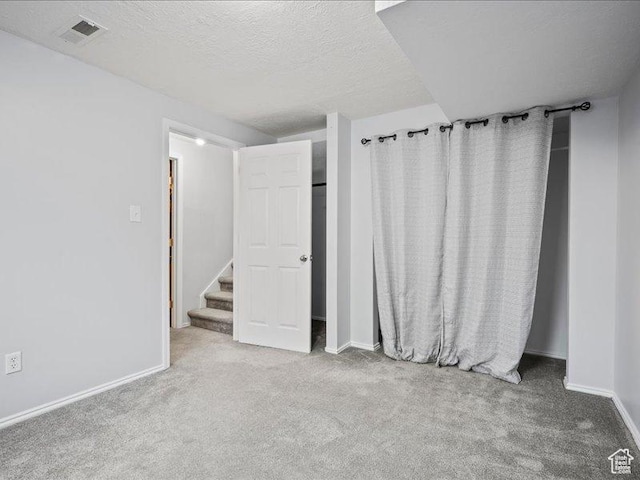 2014 S Jenny Ln, Clearfield, UT 84015 - unfurnished bedroom featuring carpet, baseboards, and a textured ceiling