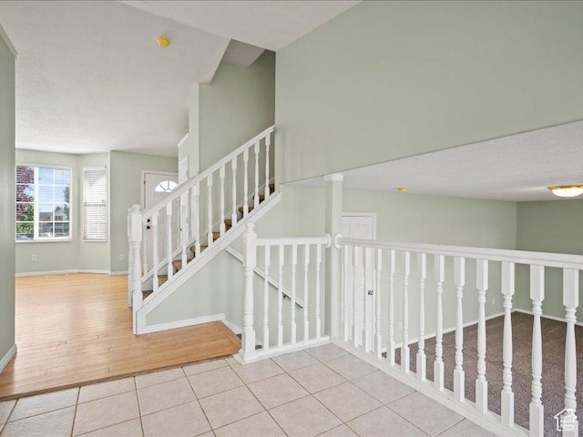 2014 S Jenny Ln, Clearfield, UT 84015 - staircase featuring tile patterned flooring and baseboards