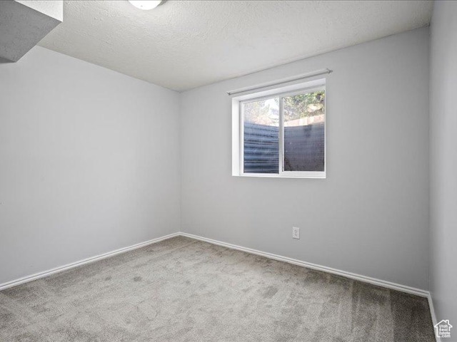 2014 S Jenny Ln, Clearfield, UT 84015 - carpeted spare room featuring baseboards and a textured ceiling