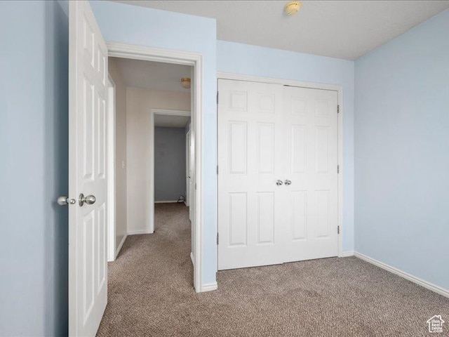 2014 S Jenny Ln, Clearfield, UT 84015 - unfurnished bedroom featuring carpet floors, baseboards, and a closet