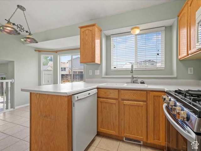 2014 S Jenny Ln, Clearfield, UT 84015 - kitchen with dishwasher, a sink, light tile patterned flooring, a peninsula, and light countertops