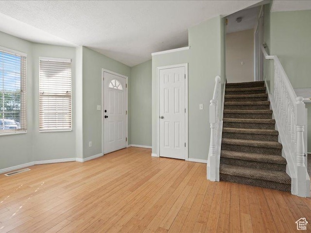 2014 S Jenny Ln, Clearfield, UT 84015 - entryway featuring light wood-style flooring, stairway, and baseboards