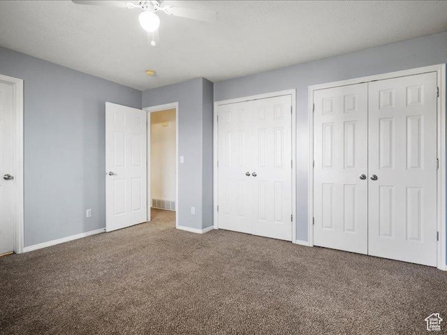 2014 S Jenny Ln, Clearfield, UT 84015 - unfurnished bedroom featuring two closets, carpet floors, baseboards, and ceiling fan