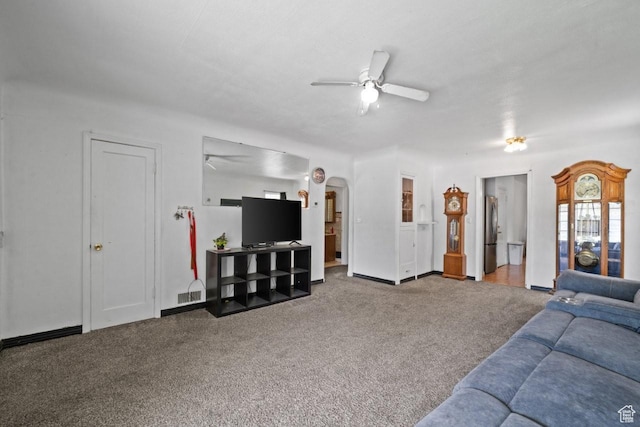 960 Patterson St, Ogden, UT 84403 - living room featuring a ceiling fan, carpet, arched walkways, and baseboards