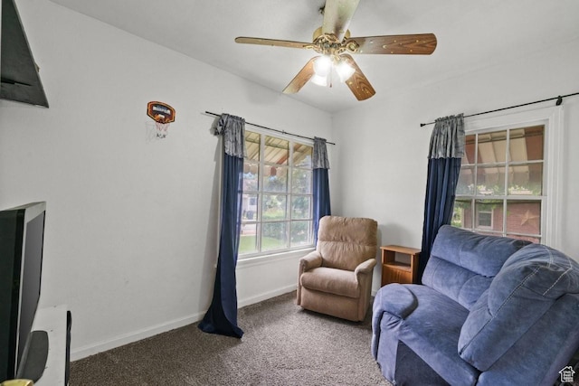 960 Patterson St, Ogden, UT 84403 - living area with carpet, baseboards, and a ceiling fan