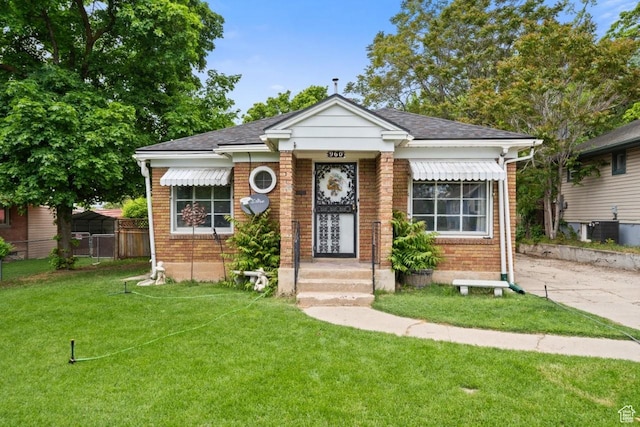 960 Patterson St, Ogden, UT 84403 - bungalow-style home featuring brick siding and roof with shingles