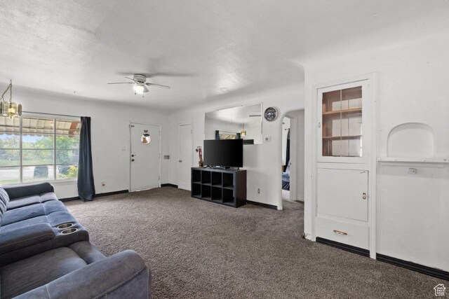 960 Patterson St, Ogden, UT 84403 - carpeted living room with a ceiling fan and baseboards