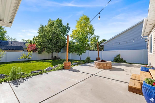 1933 N 120 W, Tooele, UT 84074 - view of patio / terrace featuring an outdoor fire pit