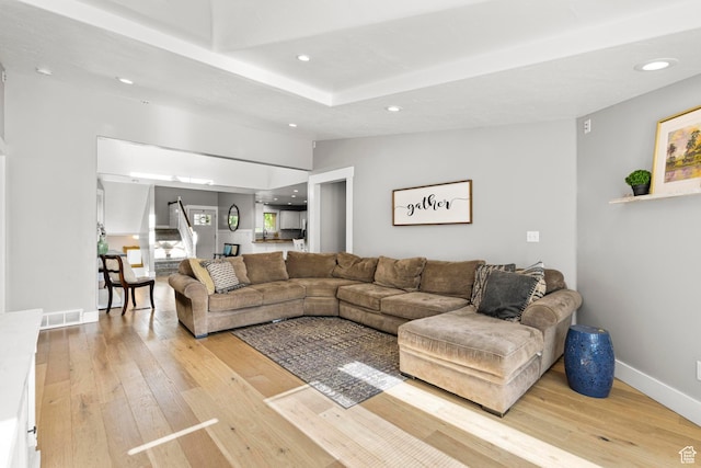 1933 N 120 W, Tooele, UT 84074 - living room featuring light wood-type flooring, recessed lighting, stairway, baseboards, and vaulted ceiling