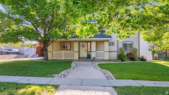 1933 N 120 W, Tooele, UT 84074 - view of front of house with stucco siding and a porch